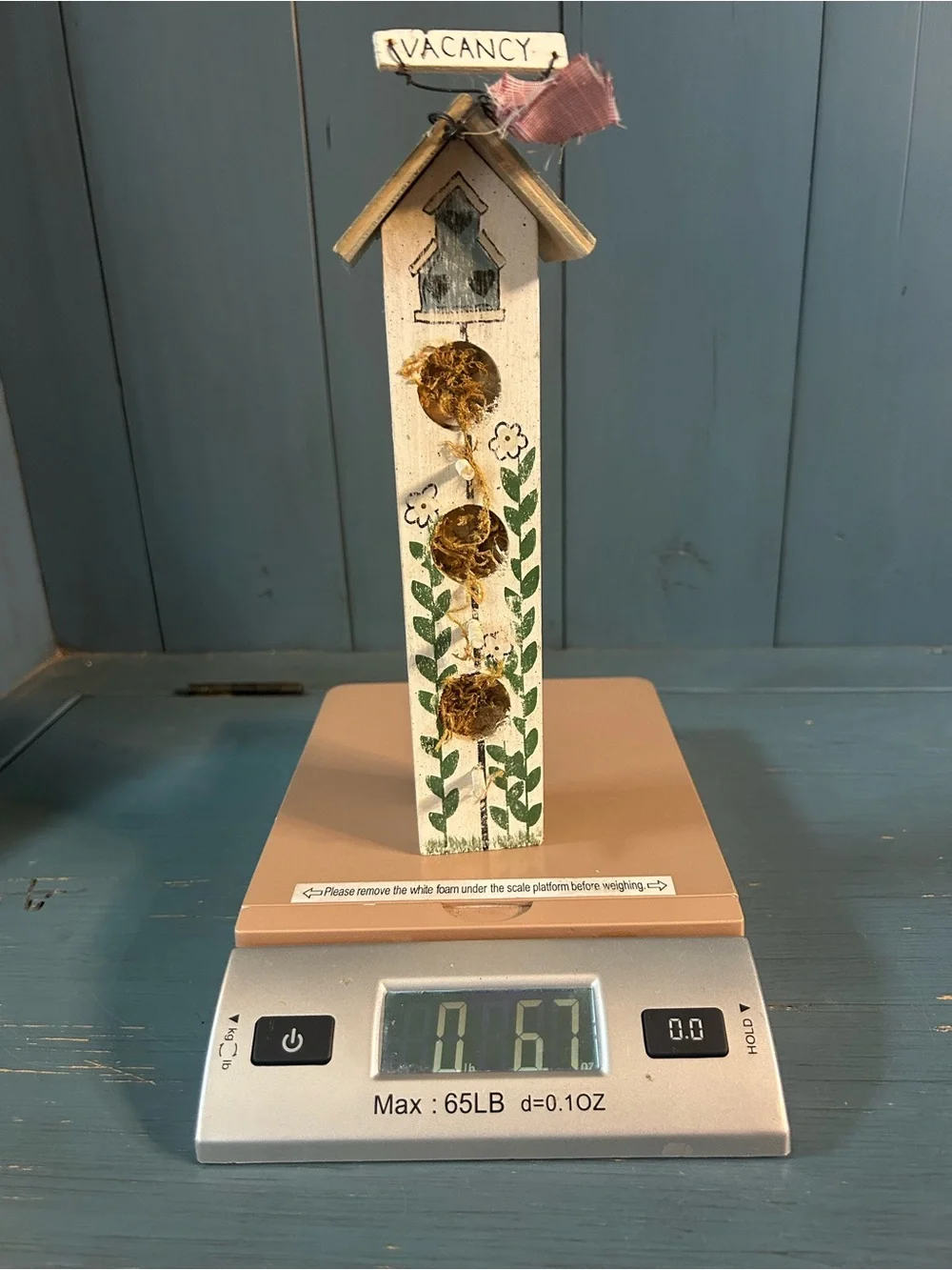 Hand Crafted White Birdhouse Wall Accent with Green Leaf and Pink Ribbon